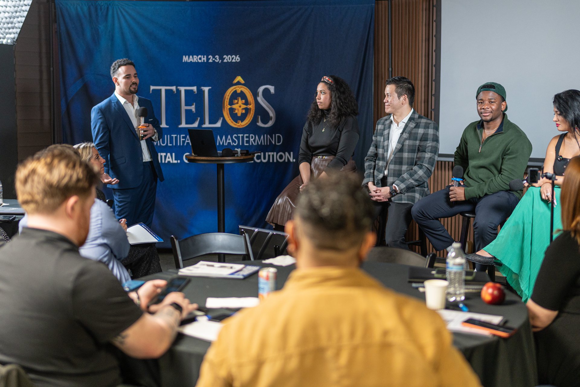 Panelists and attendees in discussion at the March 2026 TELŌS Mastermind